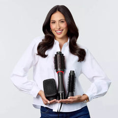 Woman holding a hair styling tool set
