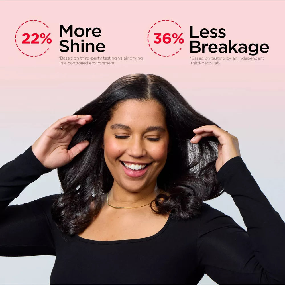 Woman with styled hair, showing 22% more shine and 36% less breakage.